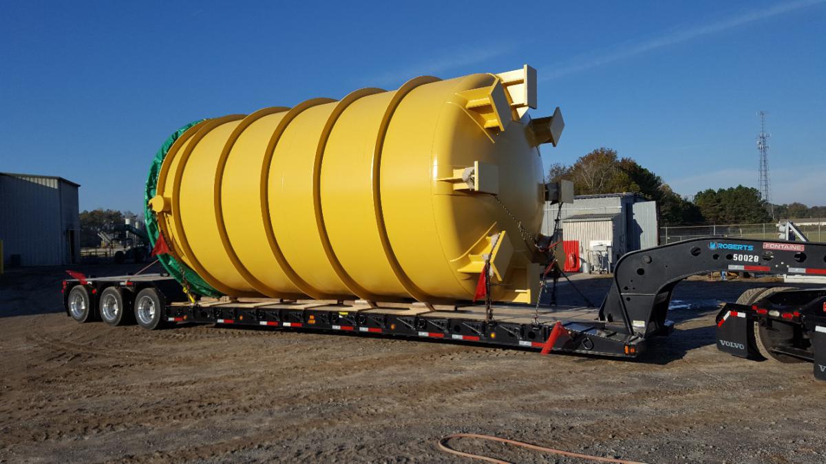 Large yellow cylinder on low boy trailer