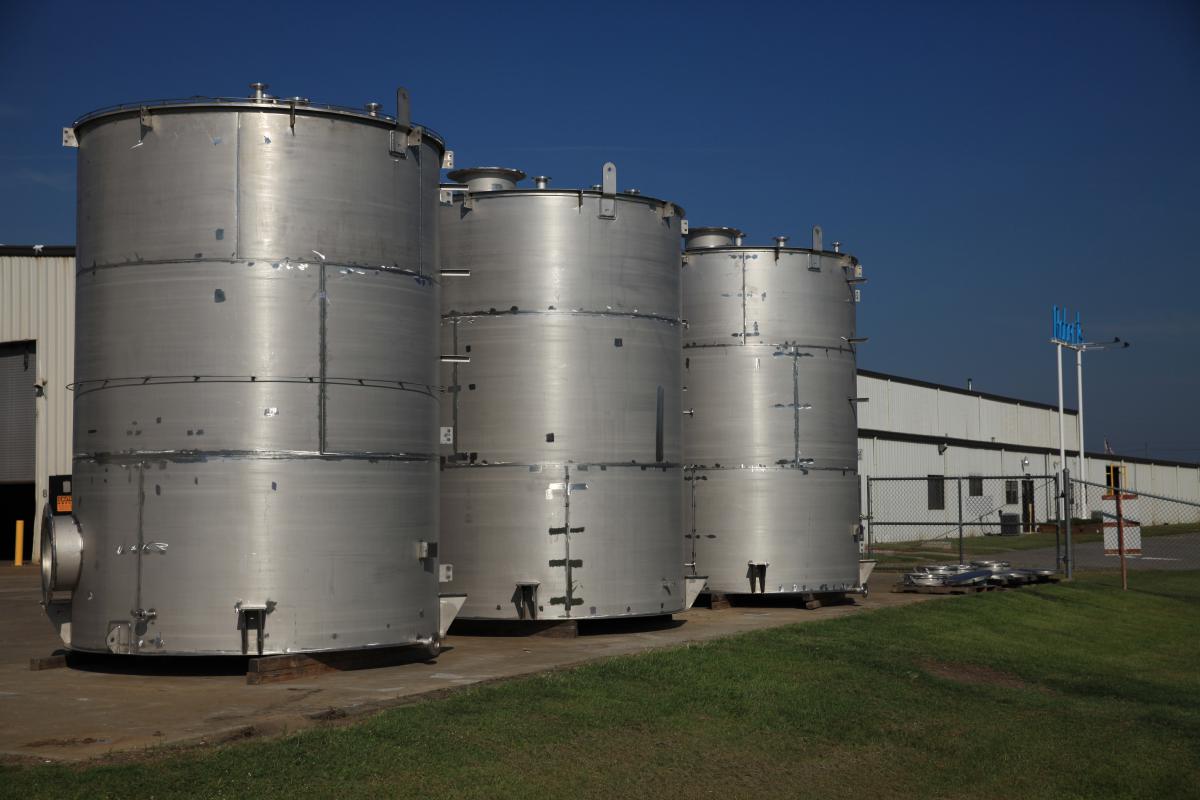 3 large metal cylinders outside